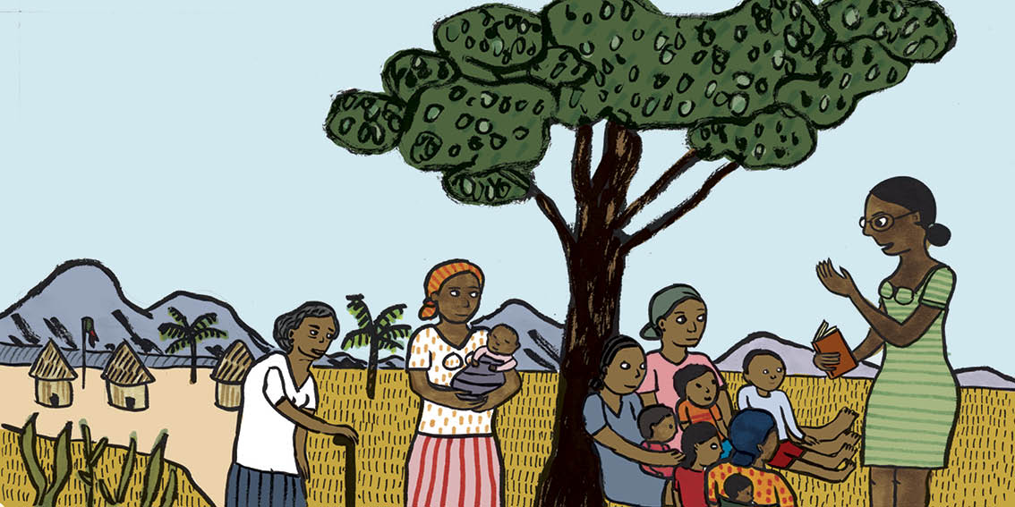 Graça stands under the shade of a tree teaching women and children from the village.